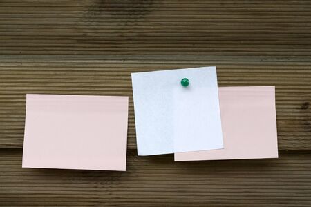Three memo sticks on wooden wall
