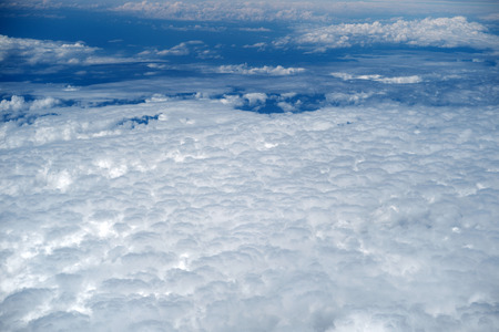 Abstract wonderful top view from flight of air hight space with clear blue sky and white fluffy air...