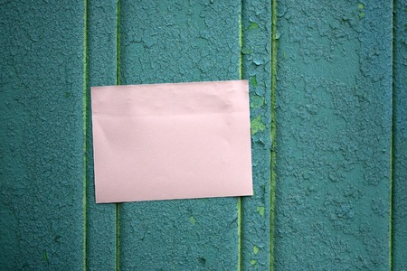 Memo stick on turquoise wooden fence
