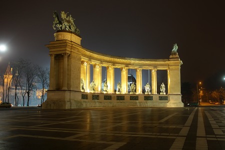 BUDAPEST - DECEMBER 12, 2012: Side view on Heroes' Square monument illuminated in evening, one of the major squares in Budapest, Hungaryのeditorial素材