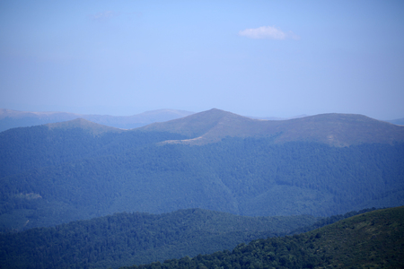Beautiful spaciousness landscape view from hill top on many high mountains with deep green forest...