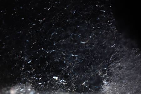 Closeup view of beautiful enigmatic mysterious white crystalline material of liquid with chemical organic foam with light as abstract natural background with no peopleの写真素材