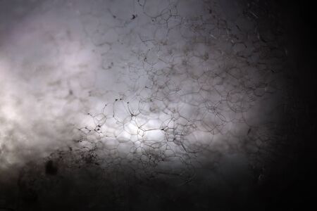 Closeup view of beautiful enigmatic mysterious white crystalline material of liquid with chemical...