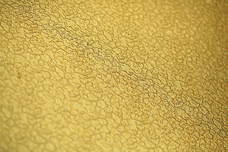 Abstract attractive artistic clear yellow colored glass material background texture decorative wallpaper copyspace closeup, horizontal pictureの写真素材