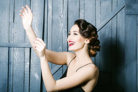 Portrait of attractive sensual glamour retro elegant young adult smiling woman with classic...