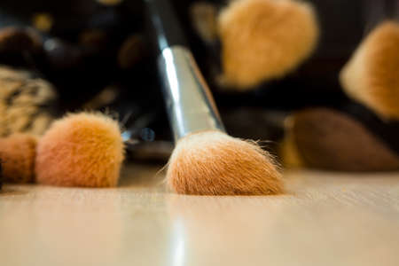 Beauty and fashion. Makeup brushes on table.の写真素材