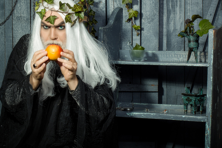 Zeus god or jupiter with enchanted apple in studioの写真素材