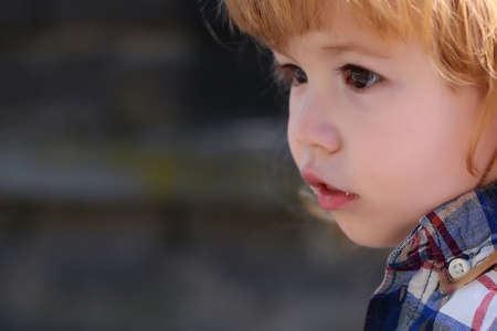 Little boy child outdoors in sunny summer day closeupの写真素材