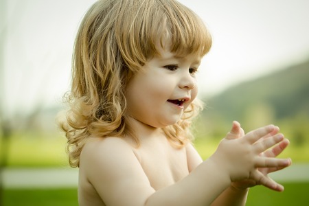 Little boy child outdoors in sunny summer day closeupの写真素材