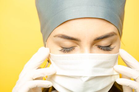 Close up of female surgeon wearing a protective mask