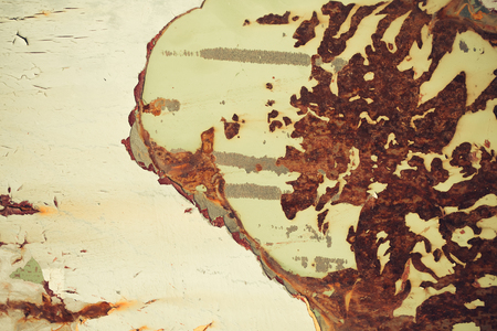 Multicolored background: rusty metal surface with paint flaking and cracking textureの写真素材