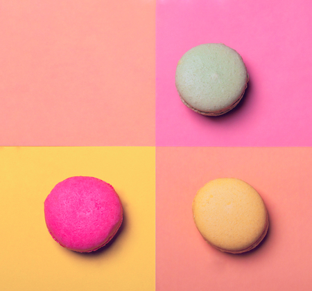 Three tasty macarons on colorful background, copy spaceの写真素材