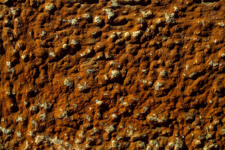 Old cement wall with faded dirty brown paint textured backgroundの写真素材