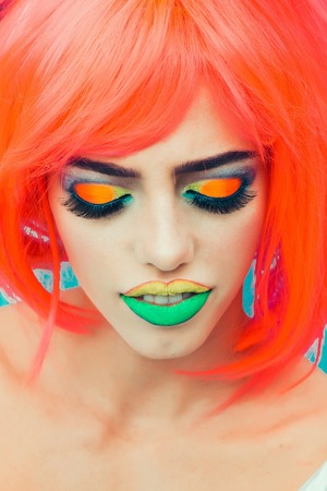 Young girl with pretty face bright professional makeup colorful eyeshadow yellow and green lips and...