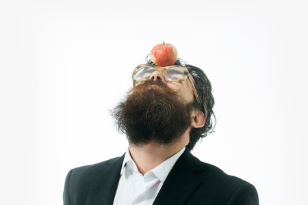 young handsome bearded man scientist or professor in glasses with long beard holding lamp isolated on white background, newtons lawの写真素材