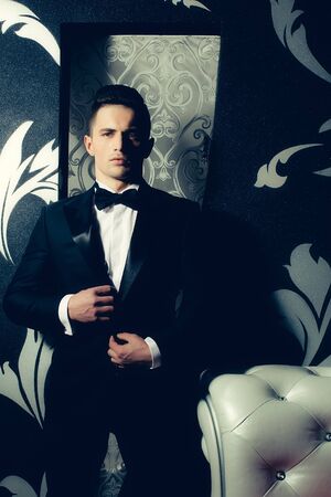 Handsome man in a black suitの写真素材