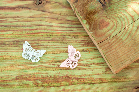 Beautiful butterfly decorative artificial plastic pins on wooden backgroundの写真素材