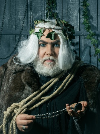 Zeus god man or jupiter with rope and medallionの写真素材