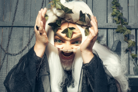 Zeus god or jupiter with magnifying glassの写真素材