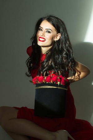 young pretty sexy woman or girl with cute smiling face and long brunette hair has fashionable makeup...