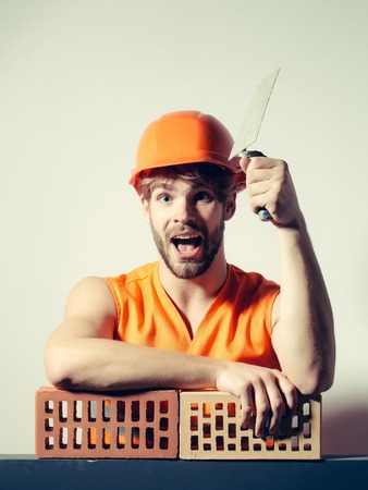 young handsome bearded macho man smiling builder with sexy muscular athletic strong body has strong...