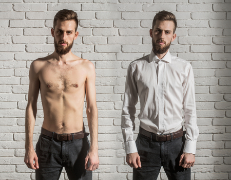 collage of handsome bearded man or hipster guy with serious face half in fashionable shirt, pants and with bare slim or thin body, chest and torso with anorexia on white brick wall backgroundの写真素材