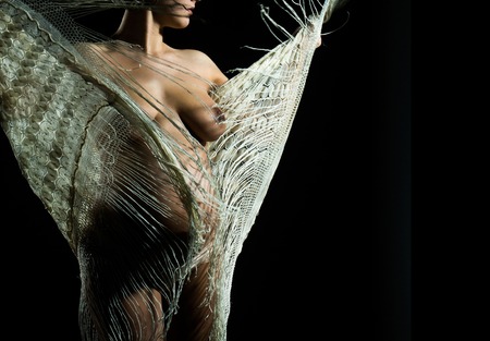 pretty happy woman or cute pregnant girl with naked sexy body, chest and round belly or abdomen in pants and white scarf isolated on black background at mothers day holiday, copy spaceの写真素材