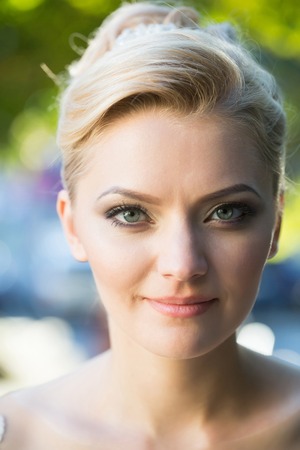 Pretty girl or cute woman with beautiful makeup on young face and blond hair, stylish hairstyle,...
