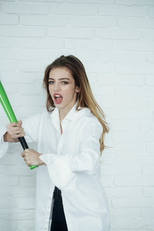 young pretty woman with beautiful long hair and red lips on adorable face in fashionable white shirt...