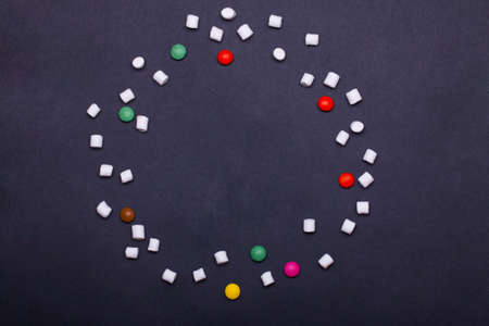 colorful tasty marshmallow, zephyr and dragee sweets on grey background, copy spaceの写真素材