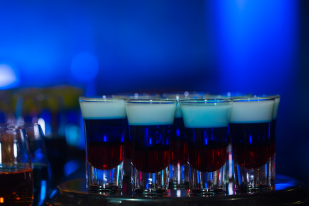 restaurant serve at wedding party with set of cocktails soft and long drinks on blue backgroundの写真素材