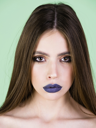 high fashion beauty model girl with black make up and long laches and hair. black lips. dark lipstick and white skin. vogue style portrait of woman on light backgroundの写真素材