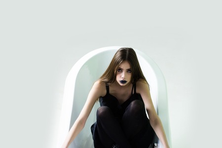woman in white bath tub in bathroom, health and hygiene, spa and relaxation, beauty and fashion,...