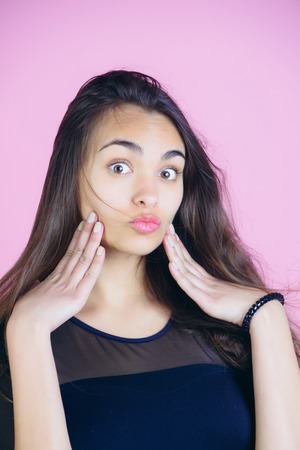girl with big eyes and surprised face, healthy, pure skin, makeup posing with brunette, long hair...