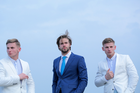 business fashion, young people in white and blue outfit on sky background, marketingの写真素材