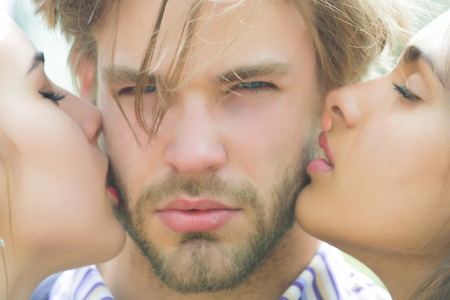 kiss of couple in love of woman and girl to manの写真素材