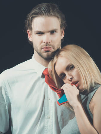 man and woman on dark background, young people, love and fashion, couple in love, familyの写真素材