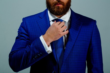 outfit or formal suit of jacket and tie on bearded man or businessman on grey backgroundの写真素材