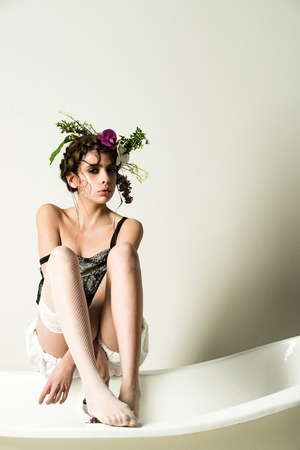 woman relax in spa bath with flower in hair, pose with healthy skin?, ikebanaの写真素材