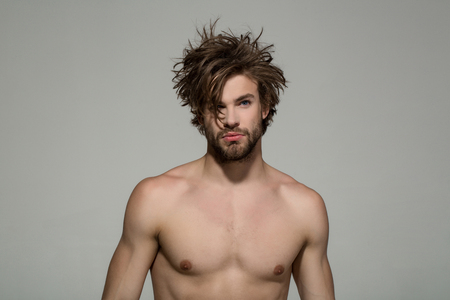 hair and beard of man with bare chest on grey background, morning and fashion, barbershopの写真素材