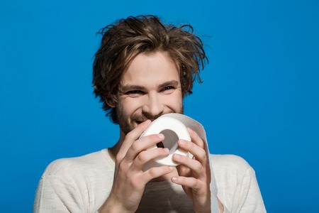 WC and restroom. Sterility and purity. Hygiene and sanitary. Man with happy face hold toilet paper. Guy in underwear in morning.の写真素材