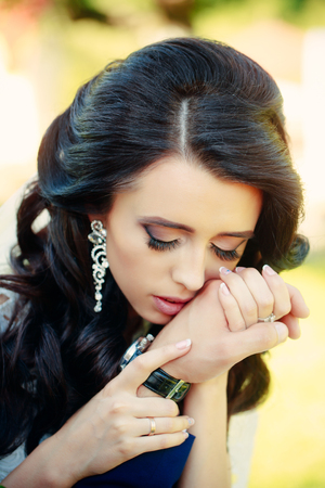 Hairdresser and barber. Cosmetics and skincare. Girl with fashionable makeup hold male hand. Beauty salon and fashion. Woman has stylish long hair in earrings.の写真素材