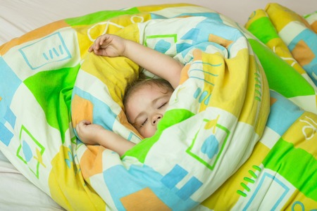 Childhood and happiness. Trust and tenderness. Small baby dreaming. Child sleep in bed. Sleepy baby...
