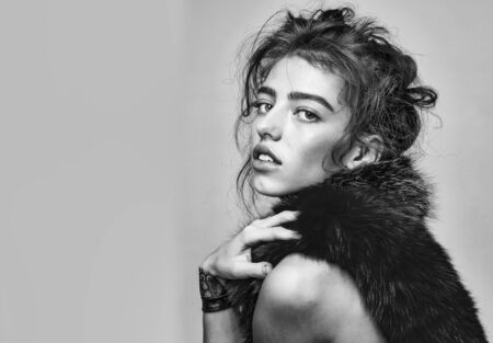 girl in fur scarf, black and whiteの写真素材