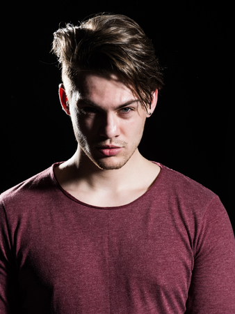 Model with stylish hair and bristle on young face. Hairdressing salon and barbershop. Male beauty...