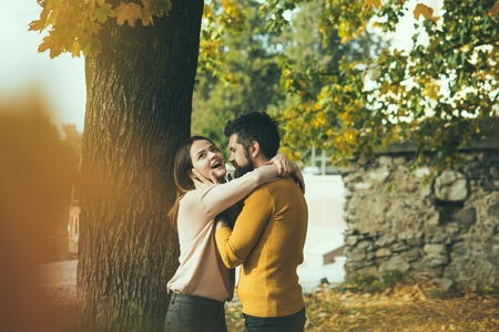 Autumn happy couple of girl and man outdoor. Love relationship and romance. Couple in love in autumn...