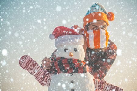new year christmas snow concept xmas leisure and winter season. Christmas man with beard on happy face. Santa claus man with snowman hat. Snowman, winter holiday celebration. New year guy, happiness.の写真素材