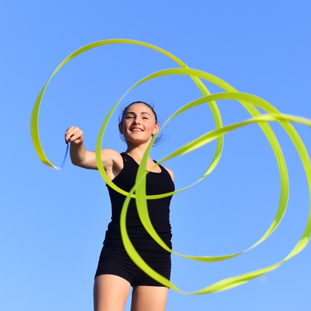 Gymnastic school and energy. Flexibility in acrobatics and fitness health. Sport and success. Woman...