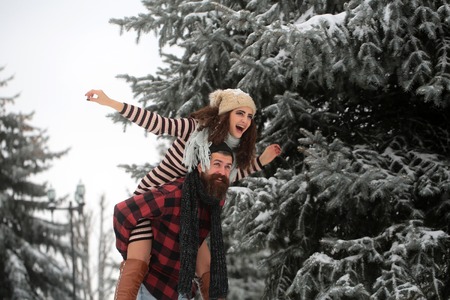 Couple in love with red santa claus hat in winter. Christmas couple of happy man and woman. Winter...