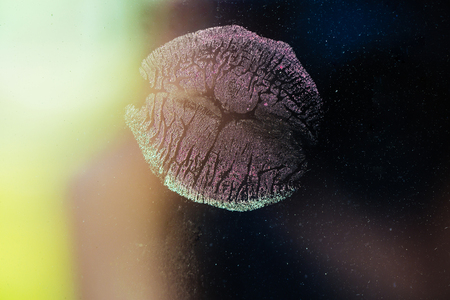 Kiss of woman or girl, sexy lips. Beauty and fashion, valentines day. Lipstick kiss imprint, love. Makeup and cosmetics, tattoo design. Lips stamp on colorful background.の写真素材
